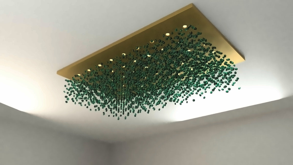 Design render of an emerald glass stone cloud chandelier under a matt gold rectangular canopy