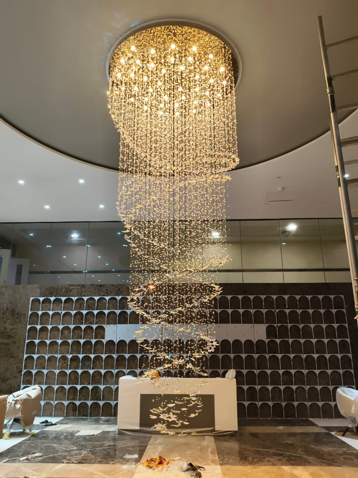 Spiral crystal butterfly chandelier installed in a Chennai mall atrium