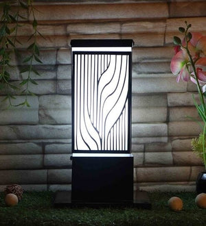 Black iron gate light with laser-cut wave pattern by Eliante, as supplied to M3M Smart World GEMS, Gurugram – lit