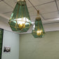Custom brass and green-tinted glass geometric pendants installed in a corporate meeting room, Hyderabad