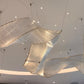 Close view of the flowing crystal and glass rod ribbons