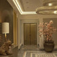 Mid-range view of the stacked geometric brass ring chandelier glowing warmly in a panelled foyer