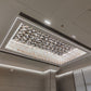 Angled room view showing the rectangular floral glass ceiling chandelier installed inside a recessed ceiling cove