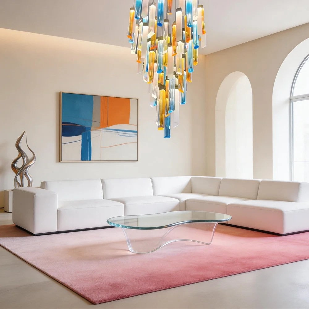 Multi-coloured cast glass bar cluster chandelier hanging above a modern white sectional sofa in a high-ceiling living room