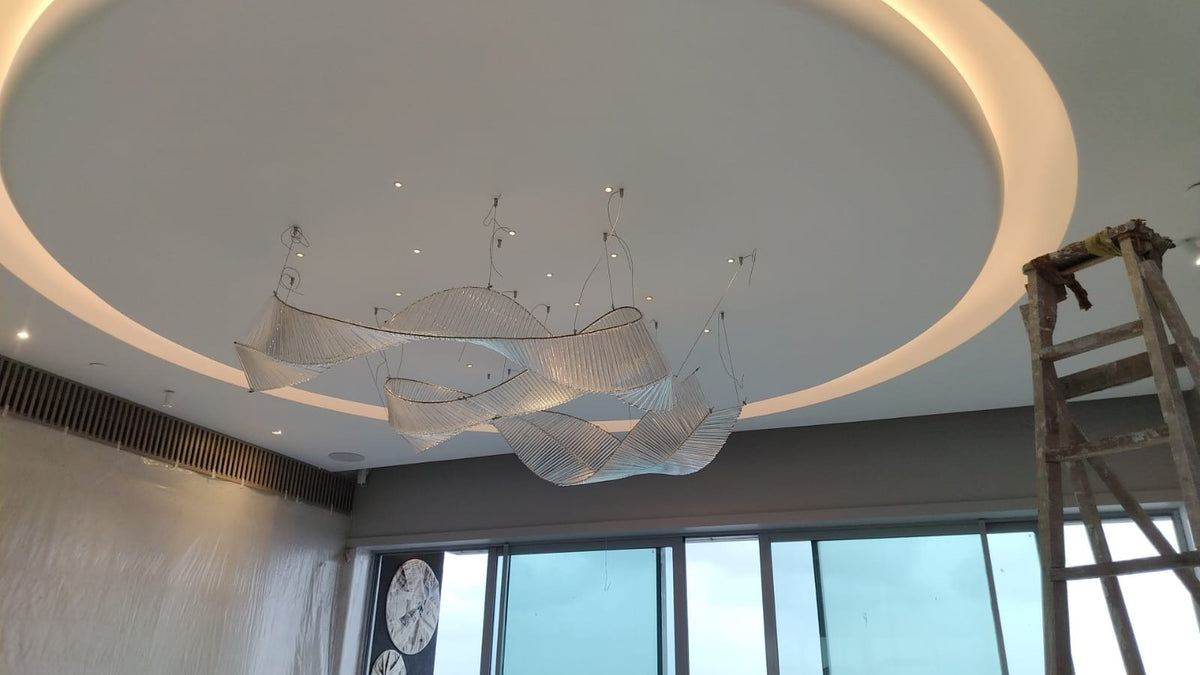 Crystal ribbon chandelier on site during final installation