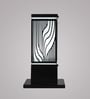 Black iron gate light with laser-cut wave pattern by Eliante – product view on grey