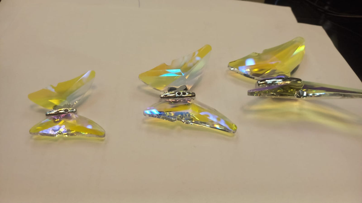 Close view of the K9 crystal butterflies used in the spiral chandelier