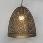 Front view of the lit perforated brass bell chandelier casting a warm glow through the cellular metalwork