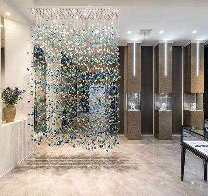 Cascading Sea-Glass Waterfall Chandelier – A Dramatic Screen for Double-Height Interiors