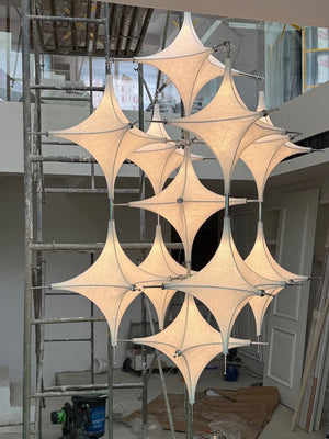 Tensile Fabric Starburst Chandelier – A Sculptural Statement for Double-Height Lobbies