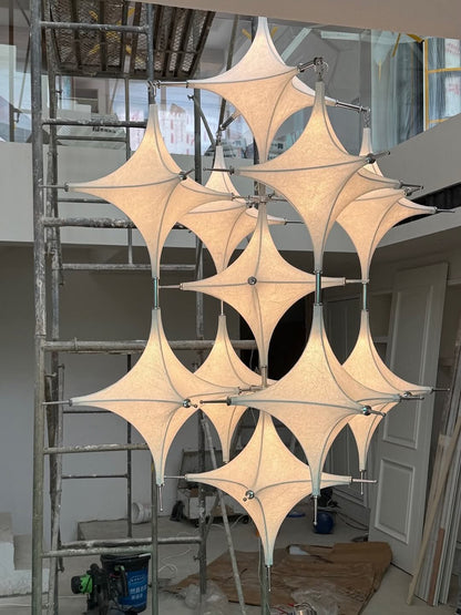Tensile Fabric Starburst Chandelier – A Sculptural Statement for Double-Height Lobbies