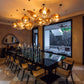 Molten amber glass bubble cluster chandelier installed above a dining table