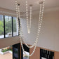 Elysian Crystal Cascade Chandelier – Modern Luxury Sculptural Crystal Hanging Light for Double Height Spaces