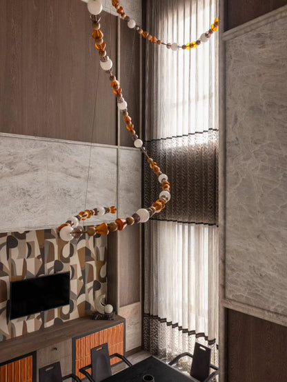 Amber Bead Wood & Glass Loop Chandelier – A Sculptural Statement for Double-Height Dining