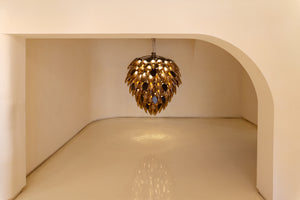 Amber Quill Glass Bloom Chandelier installed in a grand foyer, warm ambient glow