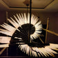 Black Rod & Frosted Glass Pinwheel Chandelier – A Sculptural Statement for Double-Height Interiors