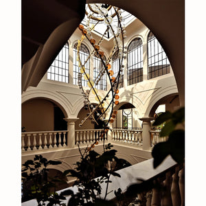 Brass Helix & Glass Disc Chandelier – A Sculptural Statement for Double-Height Atriums