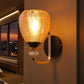 Amber Glass Wall Light with Black & Gold Metal Base | Elegant Bedroom Wall Lamp | 3 Years Warranty | Free Bulb