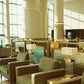 Custom glass-tube table lamps with rectangular shades in the Encalm Privé lounge (photo: Encalm Hospitality)