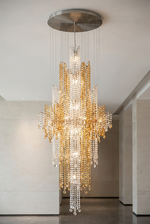 Golden Cascade Crystal Cluster Chandelier - bicolour crystal cluster chandelier in a double-height lobby