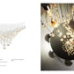 HAIDA XL composition — faceted teardrop glass suspension chandelier installed over a dining table