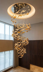 Golden Shoal Glass-Leaf Chandelier - hand-blown amber glass leaf cluster cascading from a double-height ceiling
