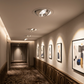 Hotel corridor idea with recessed dome downlights on artwork (illustration)