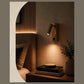 Leo Spot reading wall light in a bedroom setting