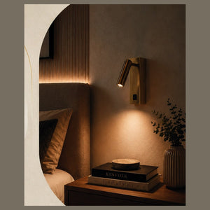 Leo Spot reading wall light in a bedroom setting