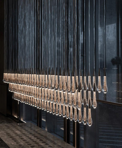 Cascading Crystal Teardrop Chandelier – A Linear Statement for Reception Foyers