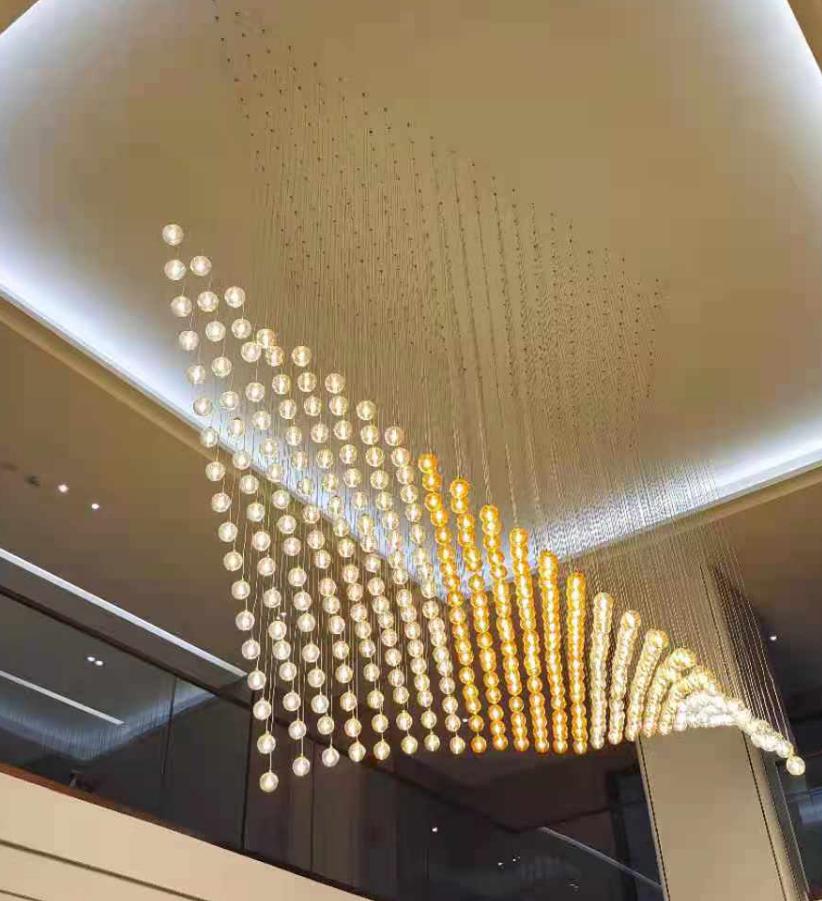 Cascading Crystal Ball Wing Chandelier – A Dramatic Statement for Double-Height Foyers
