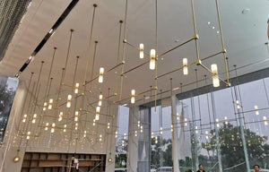 Geometric Brass Line Pendant Chandelier – A Modern Architectural Statement for Double-Height Interiors
