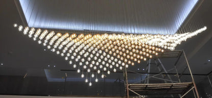 Cascading Crystal Ball Wing Chandelier – A Dramatic Statement for Double-Height Foyers