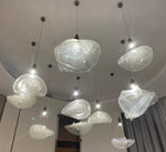 Crystalline ice-petal cluster chandelier with textured glass forms and crystal accents