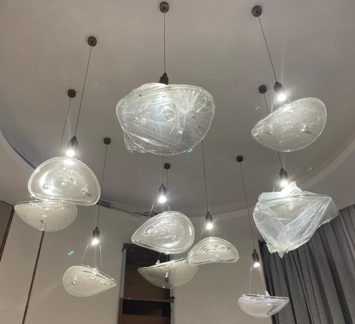 Crystalline ice-petal cluster chandelier with textured glass forms and crystal accents