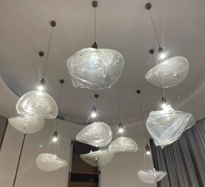 Crystalline ice-petal cluster chandelier with textured glass forms and crystal accents