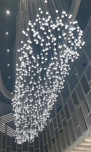Close view of the cascading LED pin cluster forming a sculptural cloud silhouette