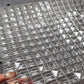 Close-up of faceted crystal tile texture on the wave chandelier panel