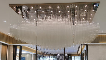 Crystal icicle flush chandelier with mirror canopy installed above a lobby