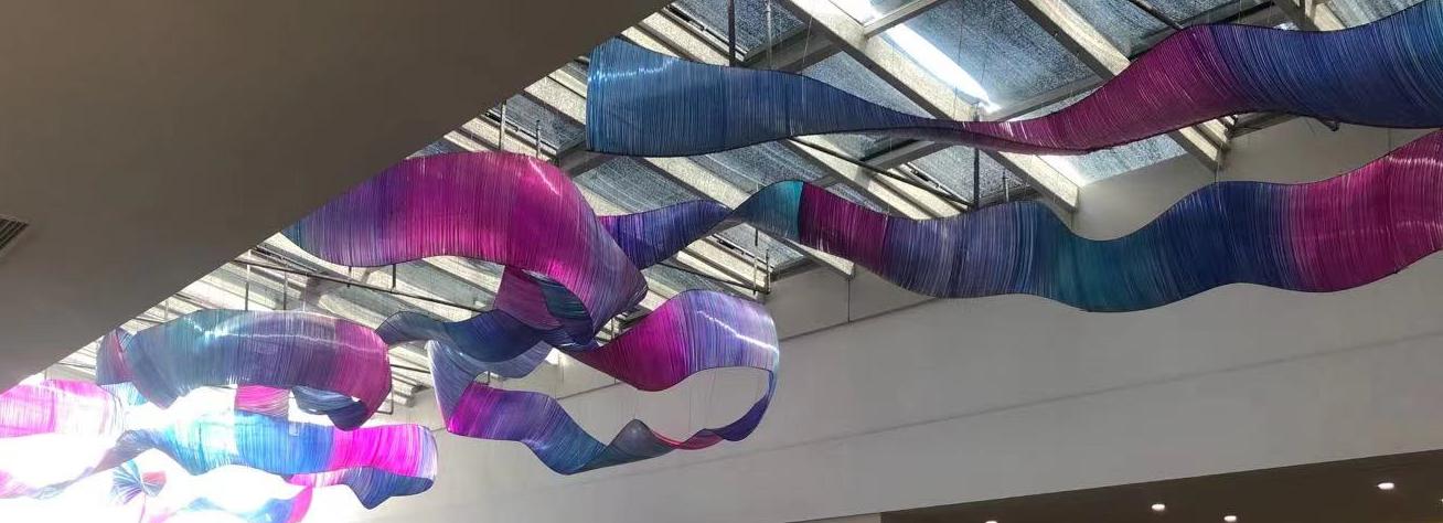 Alternate angle of the multicolour gradient ribbon sculpture chandelier