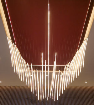 Symmetrical front view of the illuminated feather-blade wing chandelier