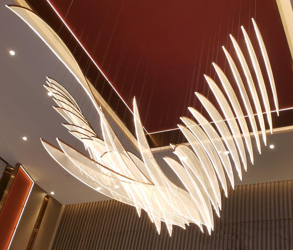 Angled view of the feather-blade chandelier showing the tiered blade structure