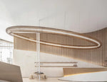Woven Mesh Halo Ring Chandelier installed at an angle in a lobby
