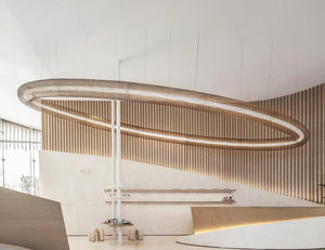 Woven Mesh Halo Ring Chandelier installed at an angle in a lobby