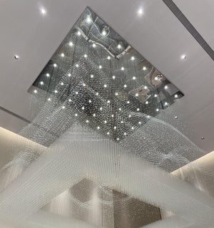 Wave-contoured crystal strand drop of the rainfall curtain chandelier