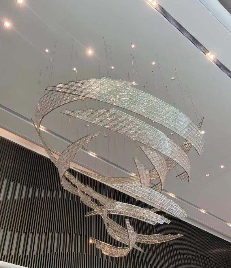 Twisted ribbon mosaic chandelier with mirrored mosaic tile bands suspended in a sculptural spiral