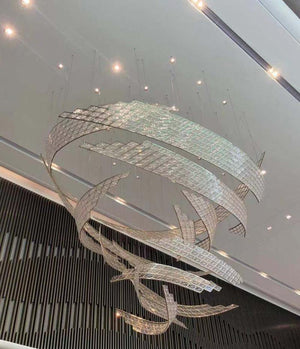 Twisted ribbon mosaic chandelier with mirrored mosaic tile bands suspended in a sculptural spiral