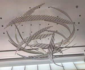 Twisted ribbon mosaic chandelier with mirrored mosaic tile bands suspended in a sculptural spiral