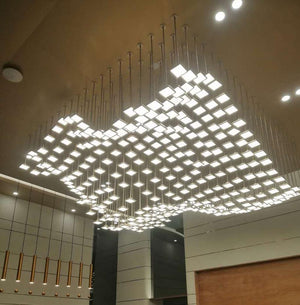 Floating Tile Cascade Chandelier – A Wave-Inspired Installation for Grand Lobbies