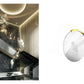 SOUL suspension collection hero – engraved crystal disc pendant over a staircase in a dark marble interior